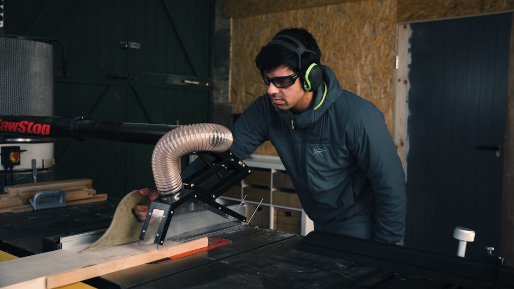Nikita working on a furniture project in the workshop